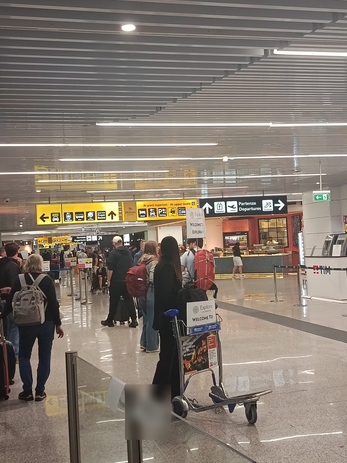 Arrivi del Terminal 1 di Fiumicino: l'autista ti aspetta qui con il cartello